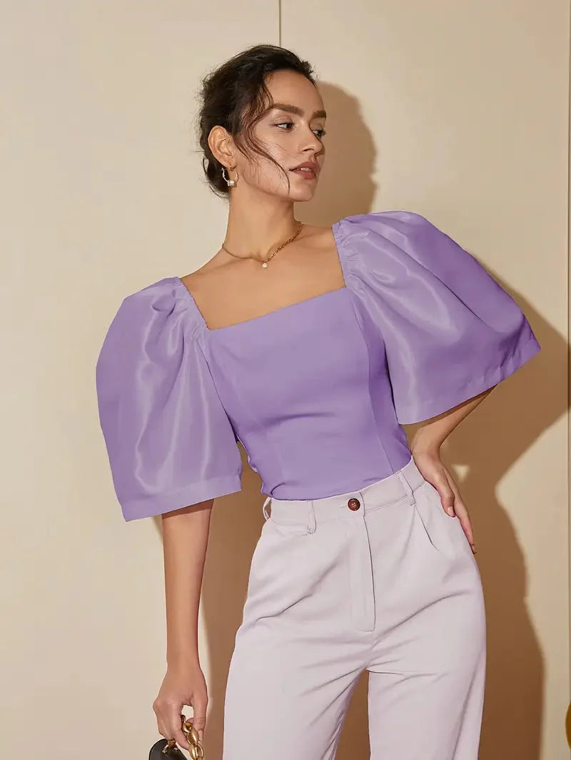 Luxuriöses Satintop mit dramatischen Puffärmeln für Damen