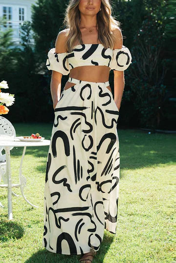 Passendes Set mit bedrucktem schulterfreiem Oberteil und Maxirock mit Ausschnitten und Taschen, perfekt für einen coolen und modischen Sommerlook